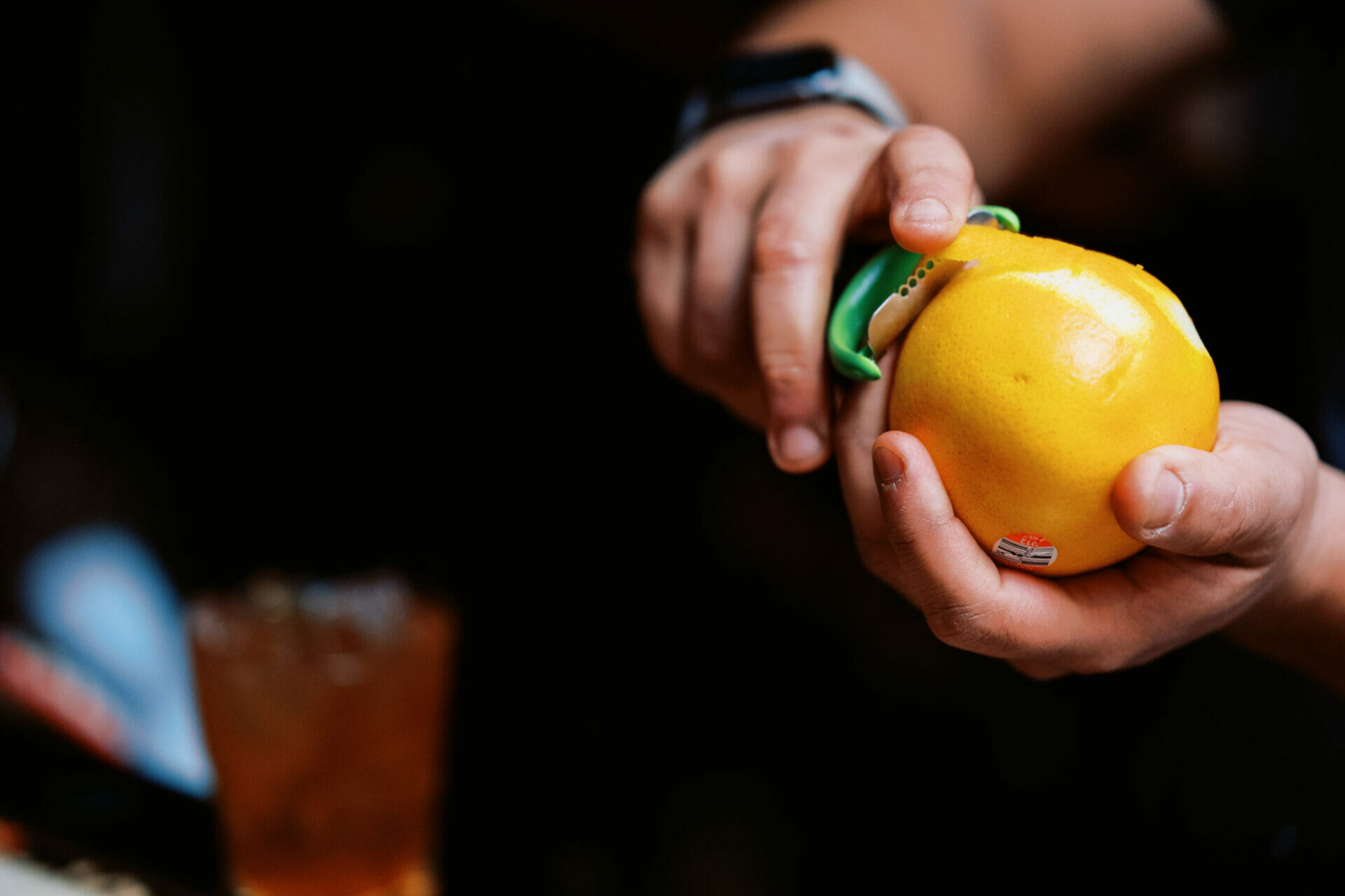 A lemon being peeled by a bartender at Le Mardi Gras in Pittsburgh, PA